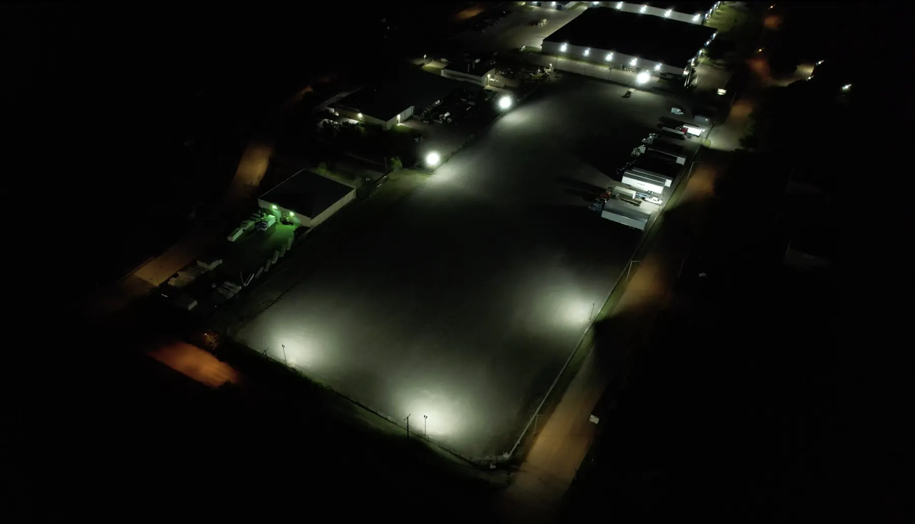 Aerial night view of Longhorn Truck Parking lot in Fort Worth, floodlit